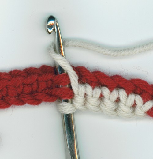 maille serrée réversible, 1er rang