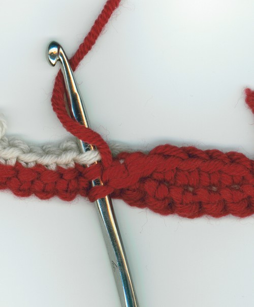 maille serrée réversible, 1er rang